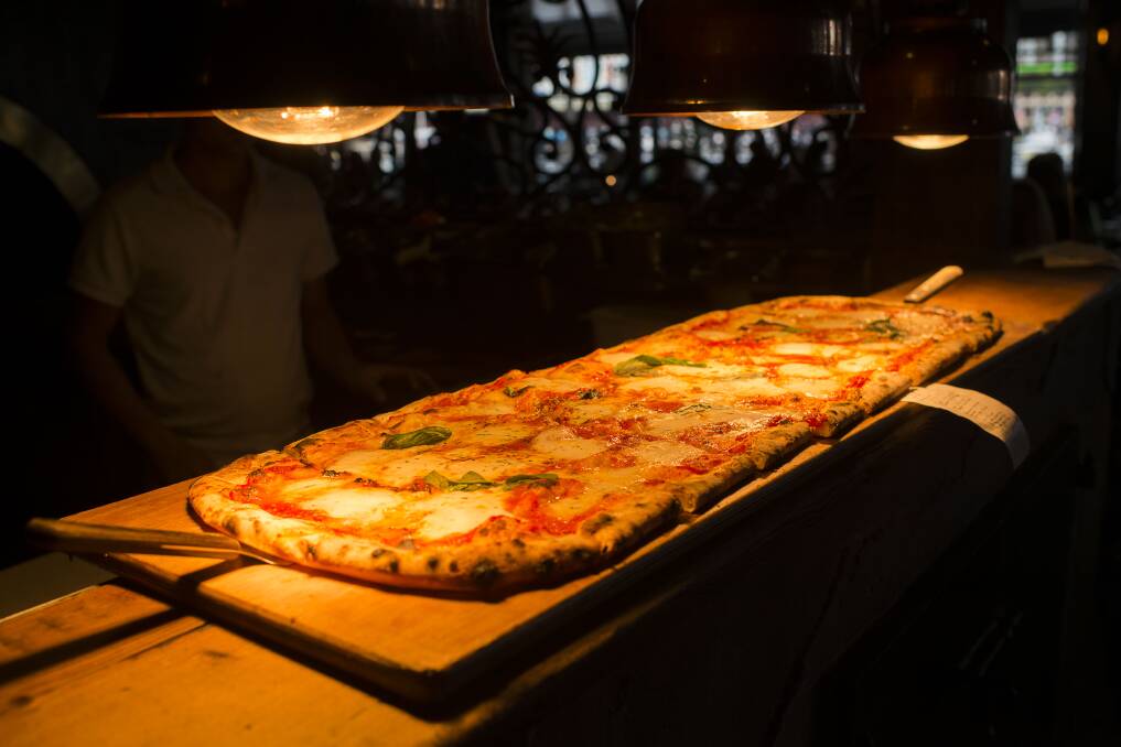 Crispy challenge: A two metre pizza at Criniti's Darling Harbour, Sydney, Australia. Picture: Christopher Pearce/Fairfax Media.
