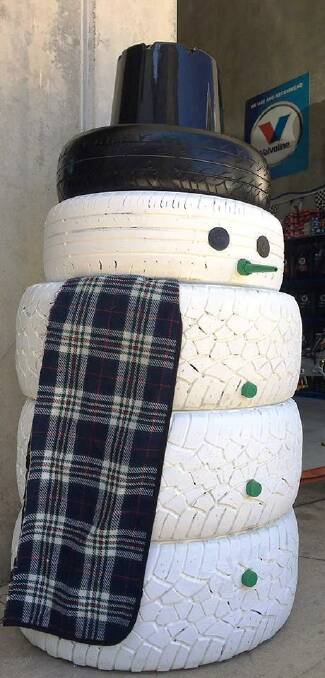 Santa has photo competition this Christmas from a Helensburgh snowman made of tyres