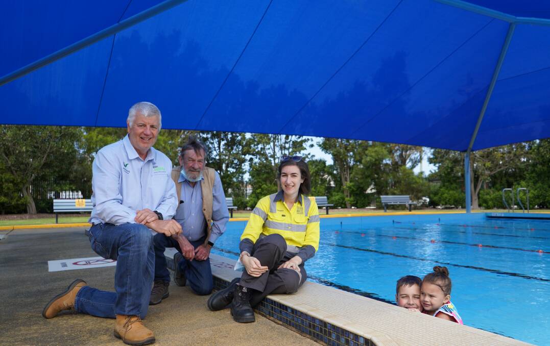 Cool, cool summer: South32 families show off the new shade cover at Western Suburbs Pool.