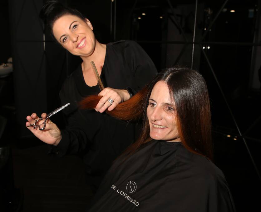 Glamour experience in Globe Lane: Sebelle Salon owner Lina Sorrentino gives mum Rebecca Grech many reasons to smile with a new hair style. Picture: Greg Ellis.

