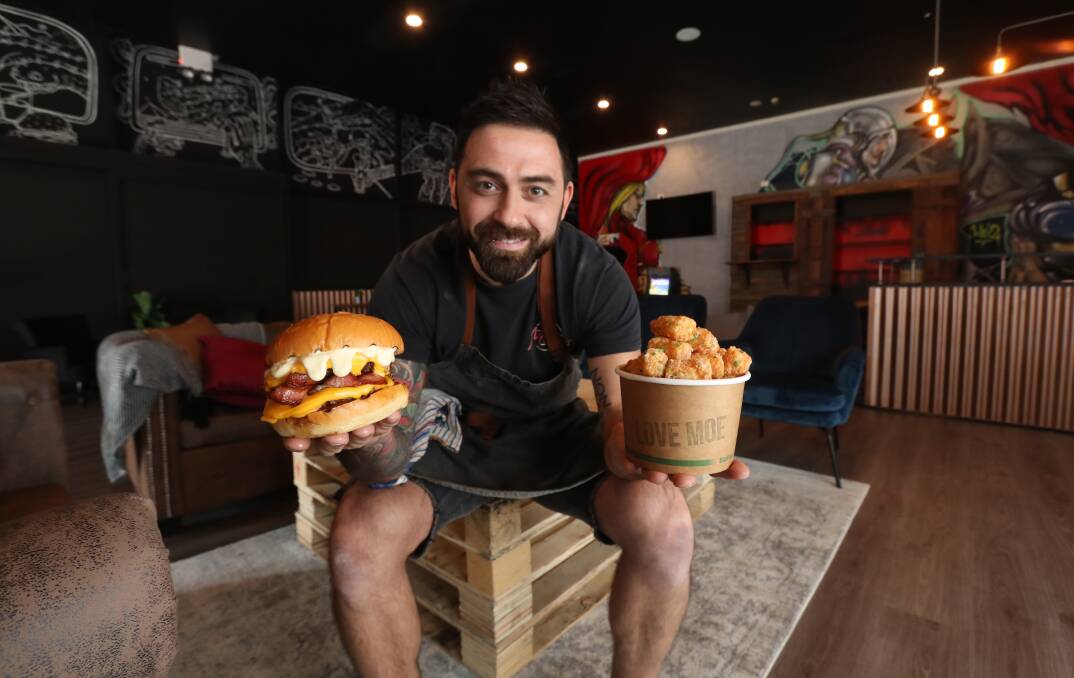 Chilling with affordable food and comedy: Maurizio Giraldi is introducing comedy nights to the new Moe's burger restaurant on the Princes Hwy at Fairy Meadow. Picture: Robert Peet.

