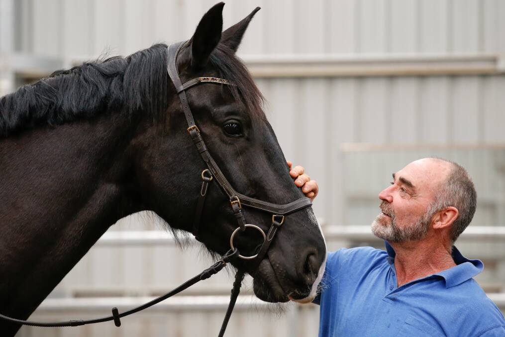 Horse whispers: Scott Brodie talks gently to one of the former race horses he is retraining with the help of veterans at Helensburgh. Picture: Anna Warr.