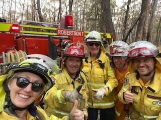 Phillipa Drewett on the left with Rural Fire Service firefighters on the Southern Highlands.
