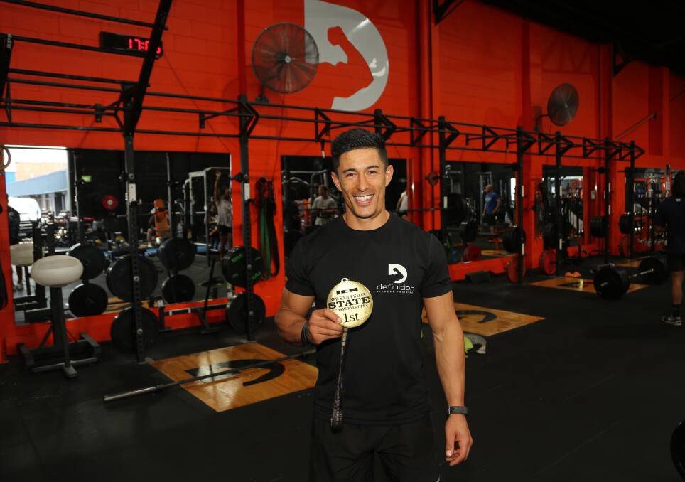 Hard work pays off: Daniel Knust with his medal after being named best natural bodybuilder in NSW. Picture: Greg Ellis.

