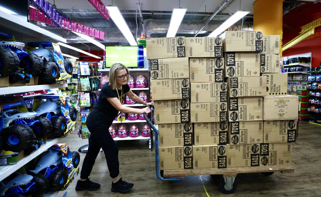 All stocked up: Three more pallets of toys arrive as Julieanne Mears talks about the early start to Christmas shopping at Casey's Toys. Pictures: Adam McLean.
