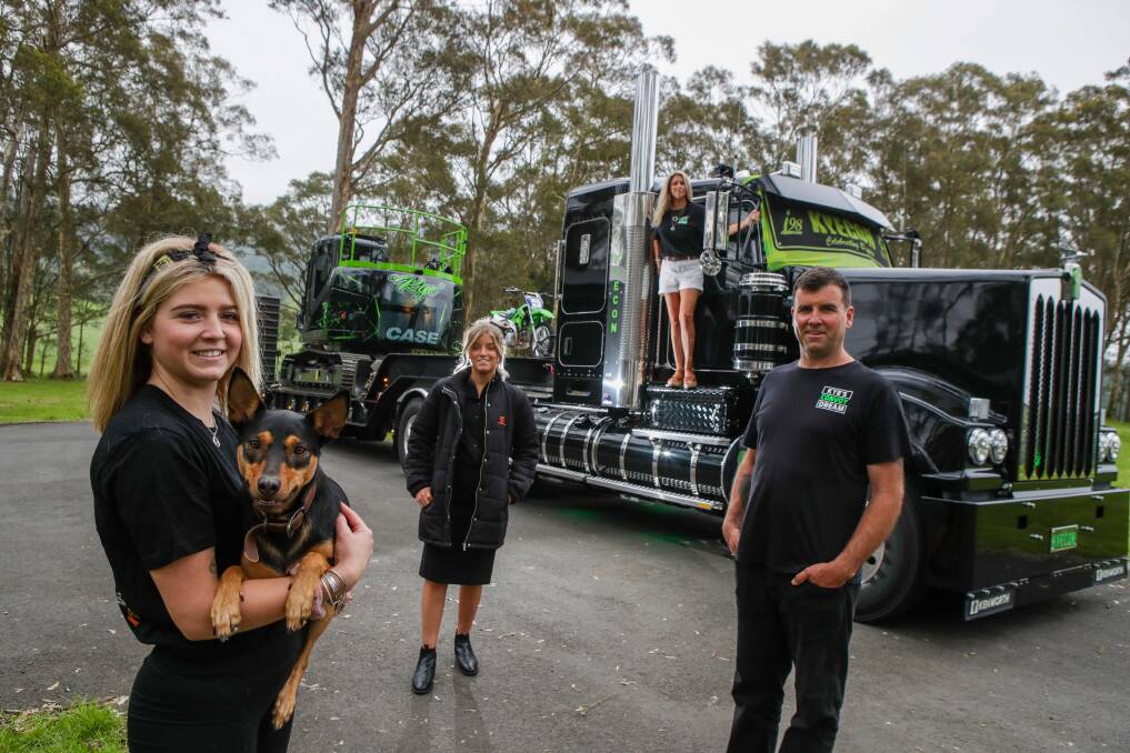 In memory of Kye: Peter Yates and Sheridan Yates with their daughters Bella and Alysha and kelpie Tia in front of Kye's Convoy Dream lead truck for this Sunday's i98FM Illawarra Convoy. Picture: Adam McLean.