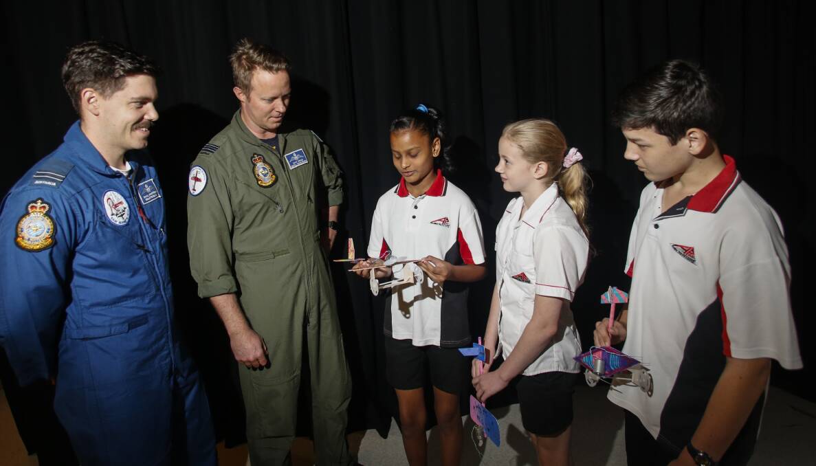 RAAF Pilots: Flight Lieutenant Dan Armstrong and Squadron Leader Gavin Oakley meet Year 7 students Shandi Presad, Savannah Mayton and Cameron Goodway involved in a STEM project. Picture: Anna Warr. 