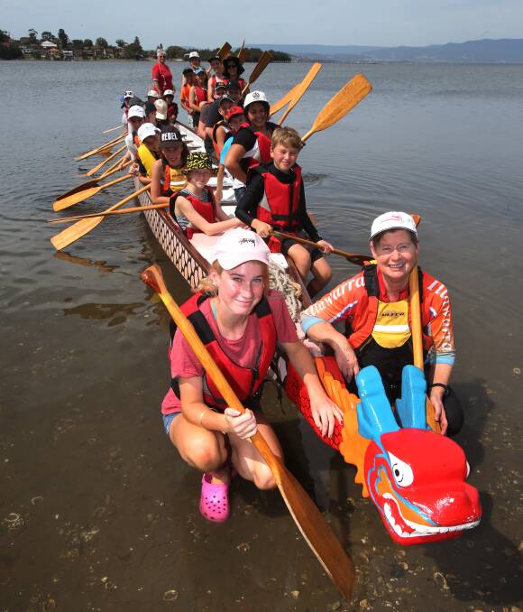 Fun day on the lake: Drew Tasker, 14, of Albury, with Illawarra Dragon Boat Club coach Catherine Holland during Wollongong Legacy Club's annual recreational camp for legatees at Lake Illawarra. Picture: Robert Peet.


