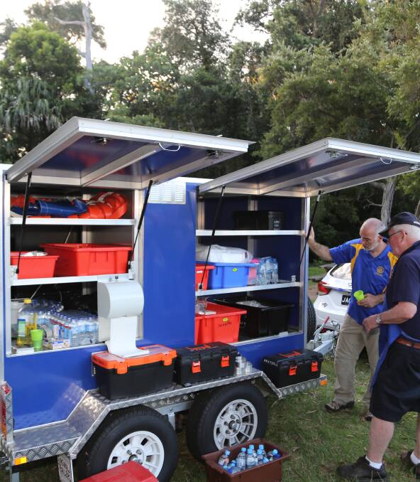 State of the art trailer: Wollongong Rotarians get the run down on all the features of their new mobile barbecue which has all the bells and whistles. Picture: Greg Ellis.
