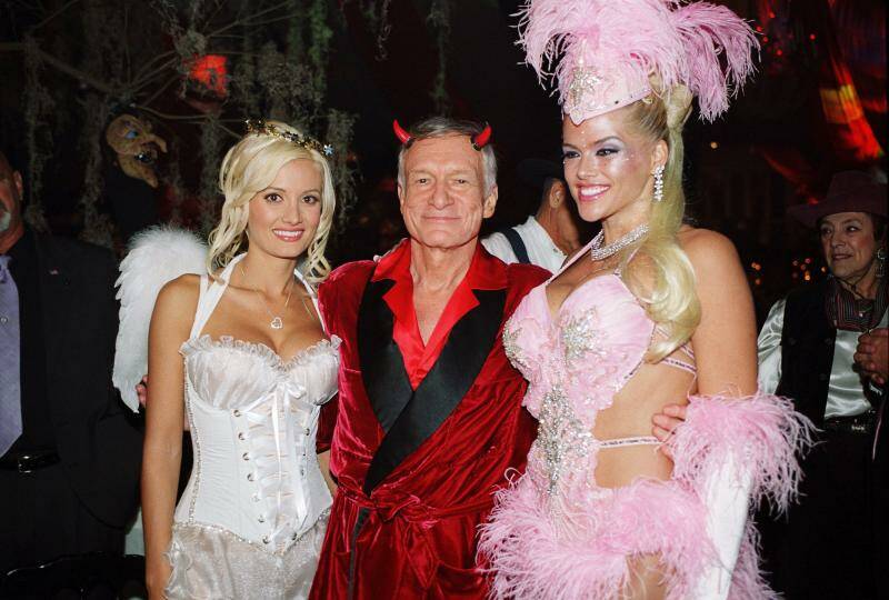 Holly Madison, left, Hugh Hefner, center, and Anna Nicole Smith pose during the Halloween party at the Playboy Mansion in Los Angeles in 2004. Picture: AP