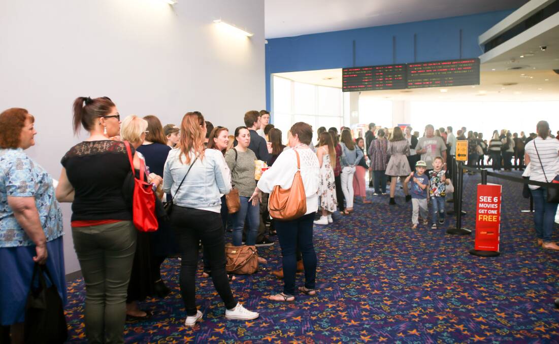 EAGER CROWD: The line-up for the red carpet premiere of family movie Rip Tide at Shellharbour's Event Cinemas. Picture: Georgia Matts.