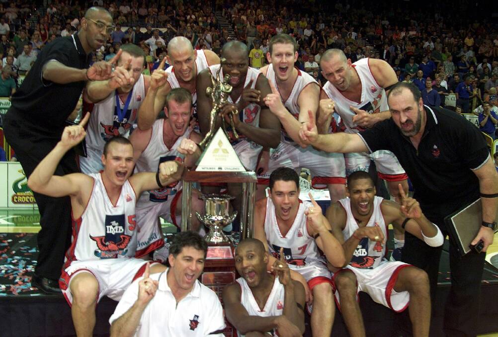 WINNERS ARE GRINNERS: The 2001 NBL championship Wollongong Hawks celebrate. Picture: Robert Peet. 
