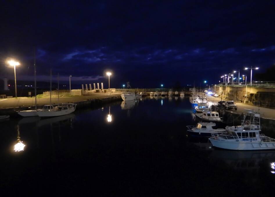 Heavy cloud and mirror-like water, taken at Wollongong harbour on April 12 by Hans Haverkamp