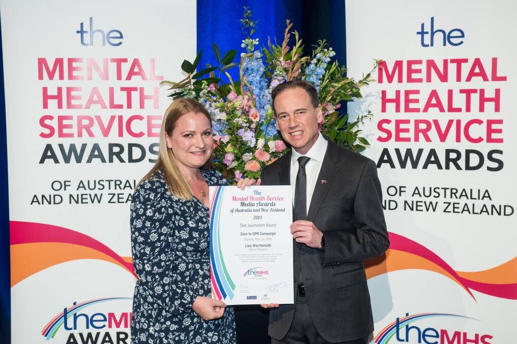 Lisa Wachsmuth being presented the award by Federal Health Minister Greg Hunt in Brisbane on Wednesday. 
