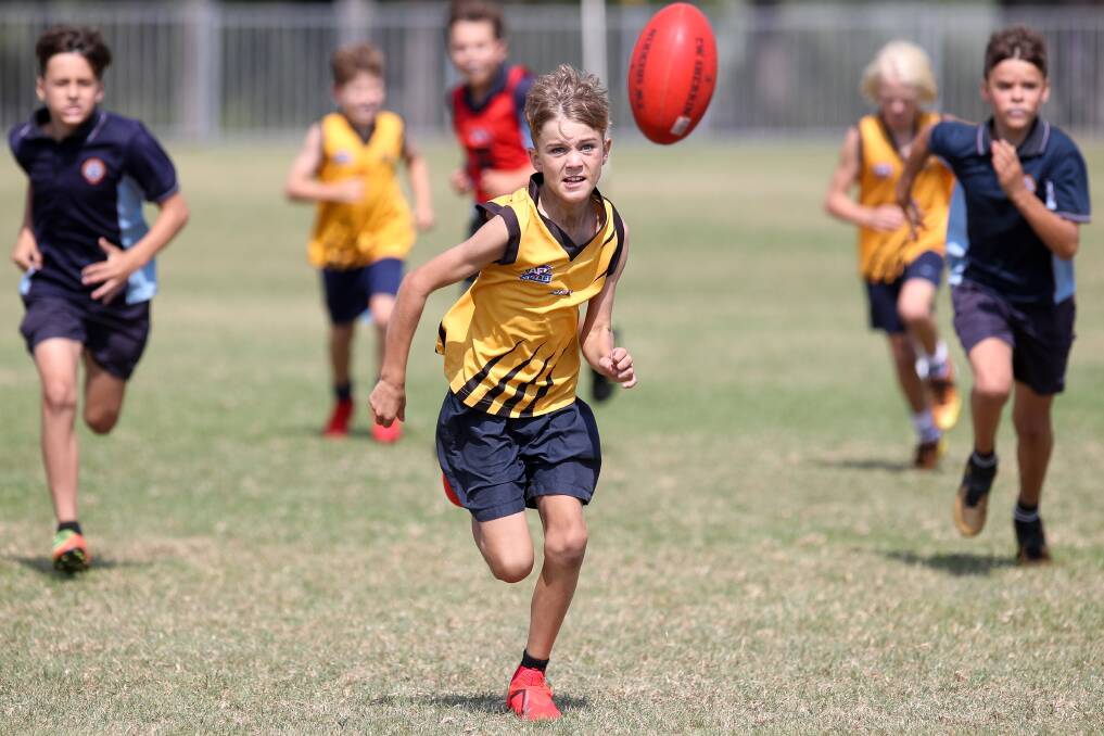 EYES ON THE PRIZE: Kalan Taylor from St Michaels Thirroul, taking part in the AFL Schools Paul Kelly Cup Wollongong qualifiers at Thomas Dalton Park in Fairy Meadow. Picture: Adam McLean.