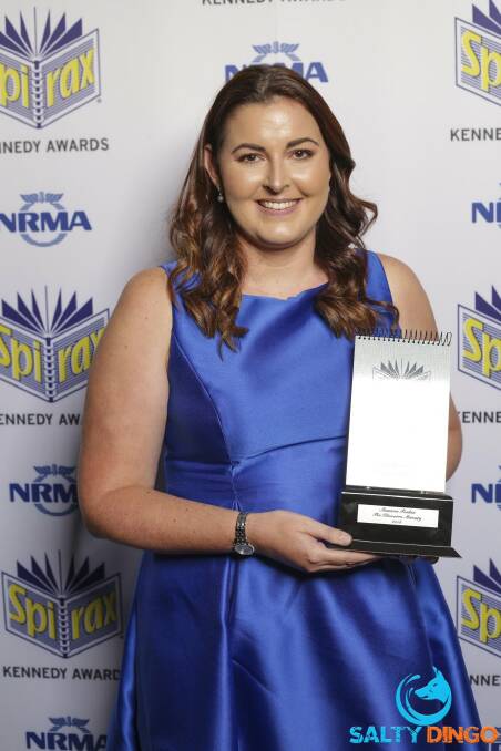 Illawarra Mercury journalist Shannon Tonkin with her Kennedy Award. Ms Tonkin has now been nominated for a Walkley Award for her work on the State of Neglect campaign.