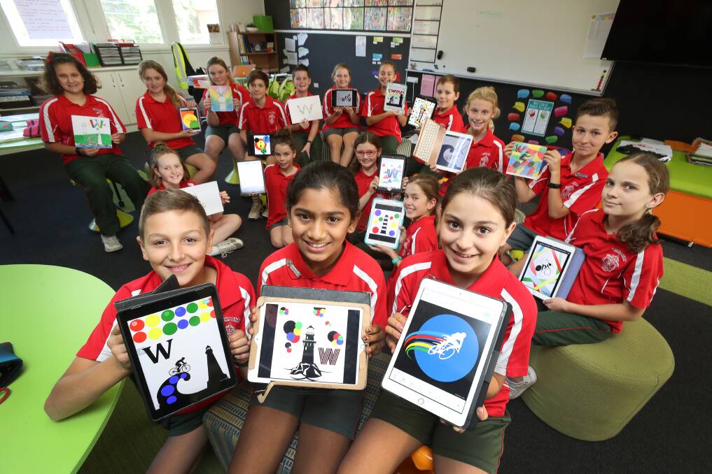 CREATIVE: Jonah Moretti (front from left), Annie Thomas and Noelia St Archangel with classmates and competition entries. Picture: Robert Peet.