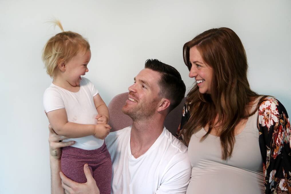 FAMILY: Walker with daughter Willow (almost two) and partner Jess. The couple are expecting their first boy on October 12. Willow and Lucas were born on the same day, December 6. Picture: Sylvia Liber. 