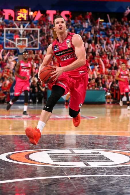NBL CHAMPION: Walker on his way to a dunk for Perth against the Illawarra Hawks in the 2017 NBL grand final series. Picture: Getty Images.