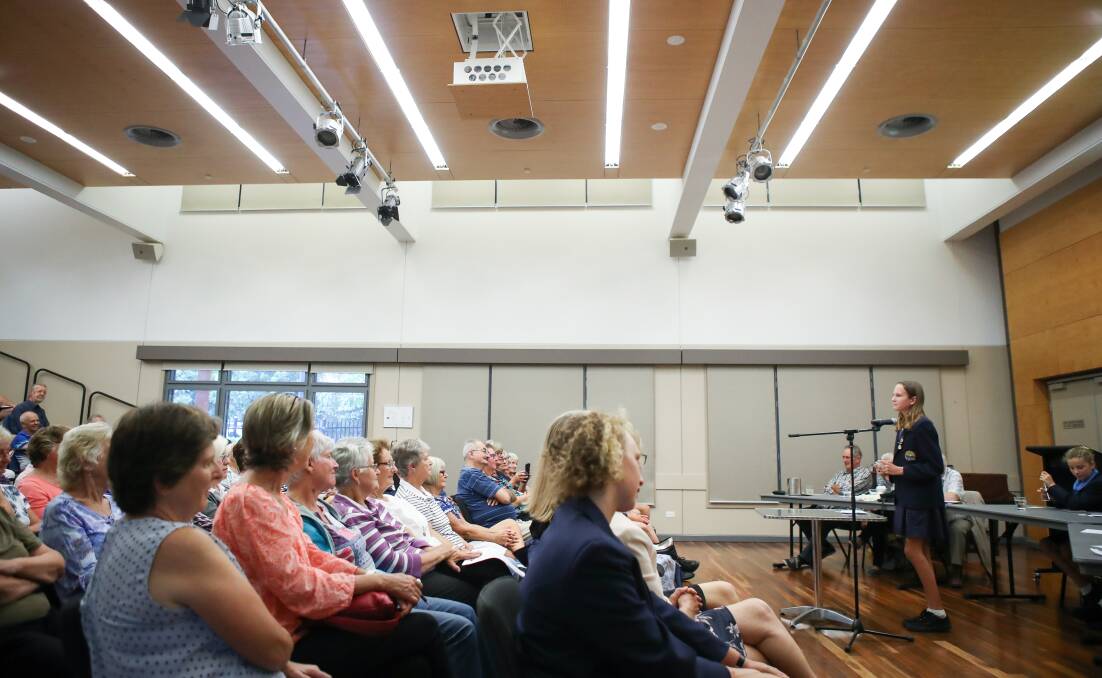 GETTING INVOLVED: Bulli High School students debate against the group of debaters from the University of the Third Age at Thirroul Library for Seniors Week. Picture: Adam McLean. 