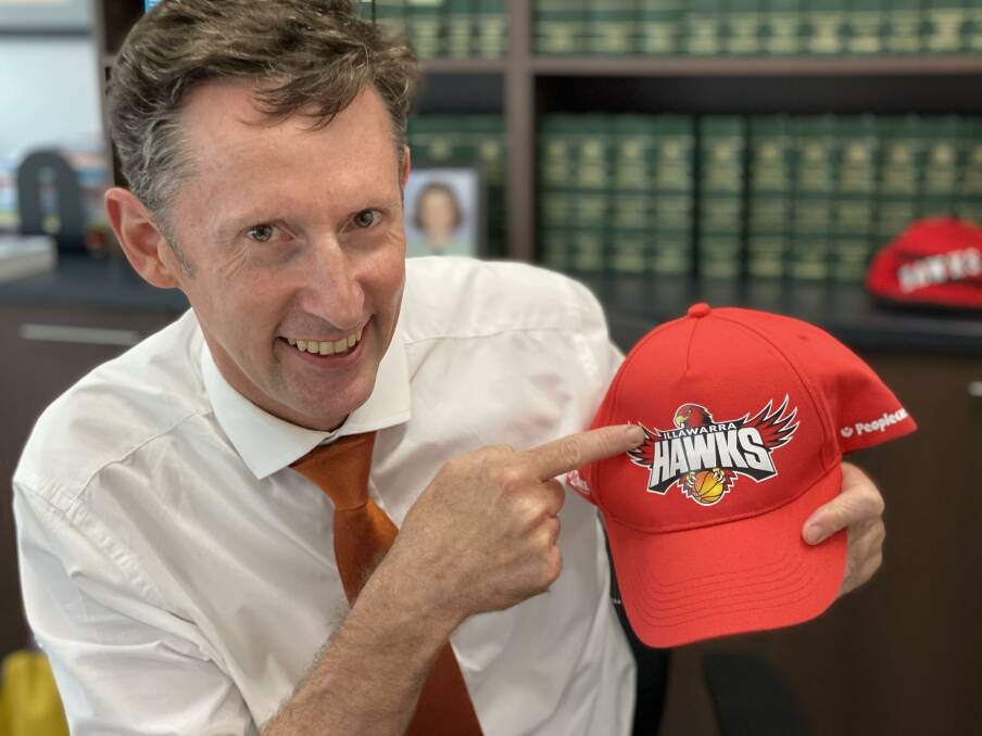 PROUD HAWKHEAD: Whitlam MP Stephen Jones with his Illawarra Hawks cap. 