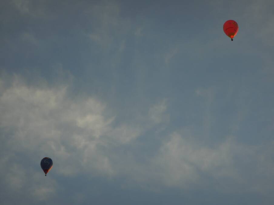 Two balloons abive Wollongong by Hans Haverkamp