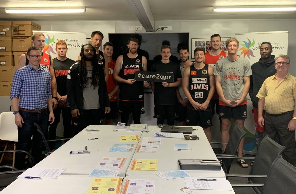 TRAINING DONE: The Illawarra Hawks with Dr Alex Hains (left) and Brian Boulton (right) from the Illawarra Shoalhaven Suicide Prevention Collaborative. 