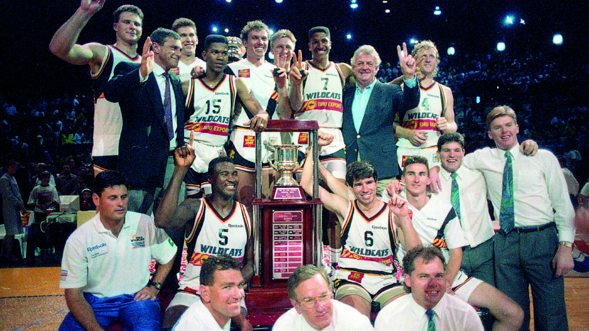 CHAMPS: Mike Ellis (no. 6 on the right of the trophy) after winning the 1991 NBL championships. Picture courtesy of the Perth Wildcats.