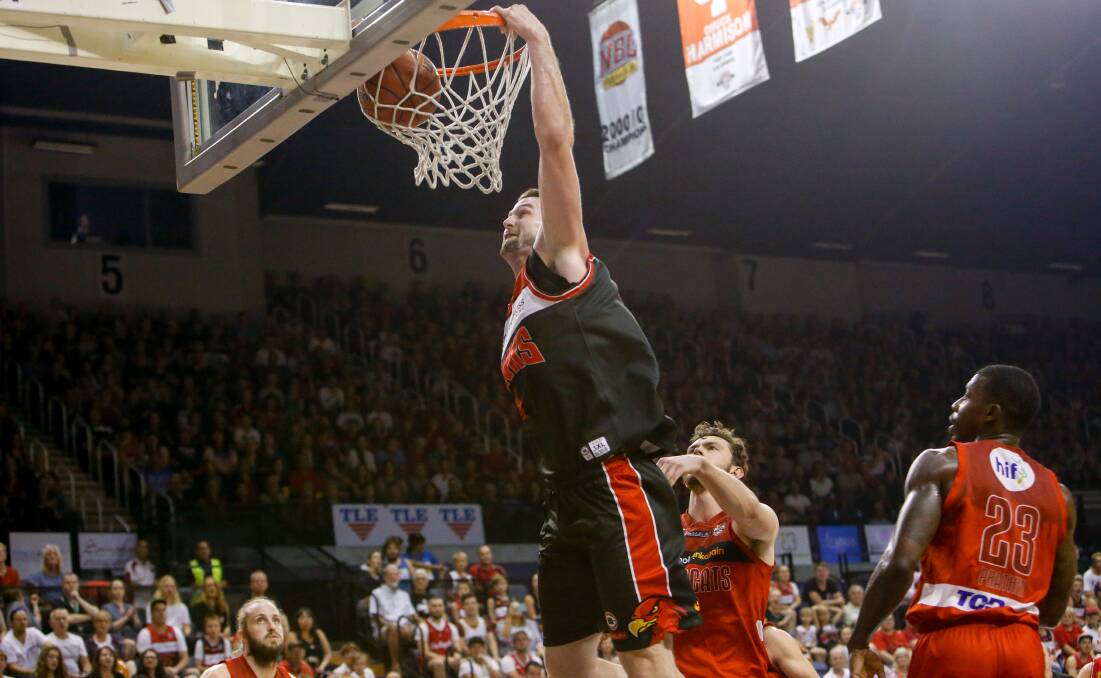 STAR: Hawks centre AJ Ogilvy doing what he does best against the Perth Wildcats. 