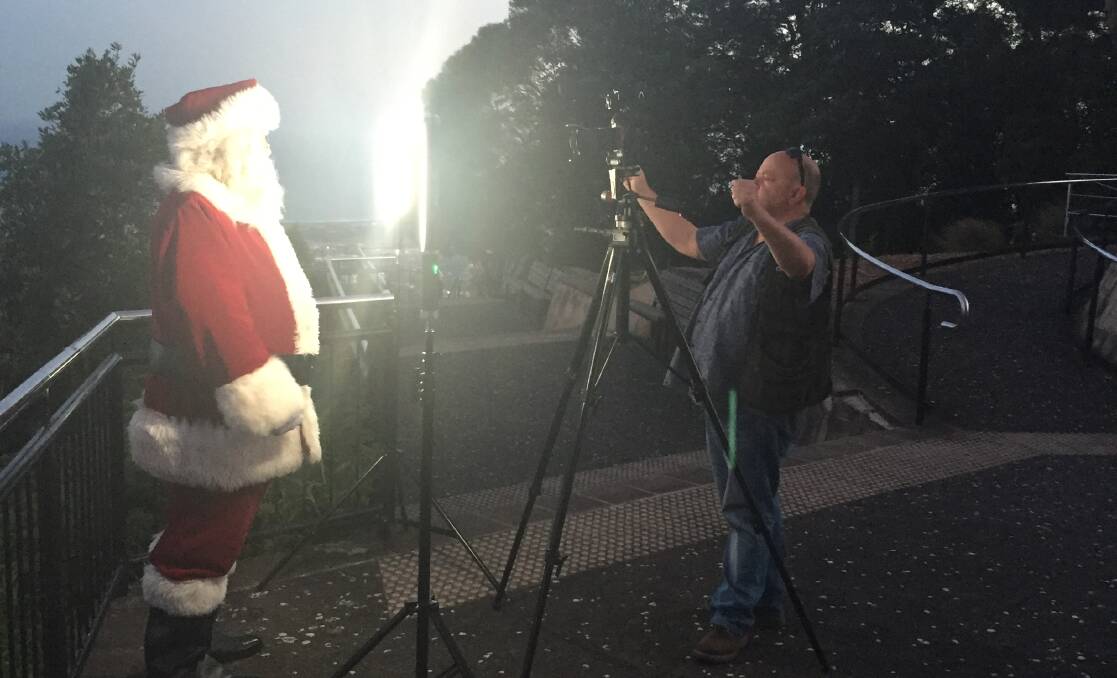 SPECIAL MESSAGE: Santa delivering his message to the children of the Illawarra which will appear on our website at 6 pm on Christmas eve. Picture: Julian O'Brien.