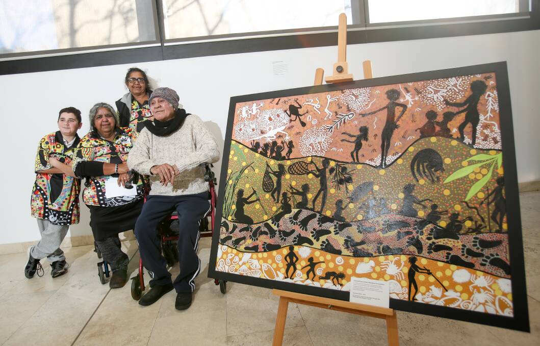 NAIDOC WEEK: Artists (from left) Dee-Jaye Brown, Aunty Lorraine Brown, Aunty Narelle Thomas and Uncle Sonny Brown with an artwork given to IRT for NAIDOC week. The IRT Foundation is celebrating the evolution and success of the Coomaditchie United Aboriginal Corporation's Capturing Culture project. Picture: Adam McLean.

