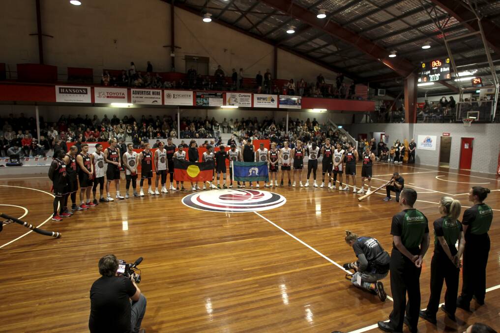 The Illawarra Hawks and the Australian Indigenous All-Stars together for the game's welcome to country. Pictures: Anna Warr. 