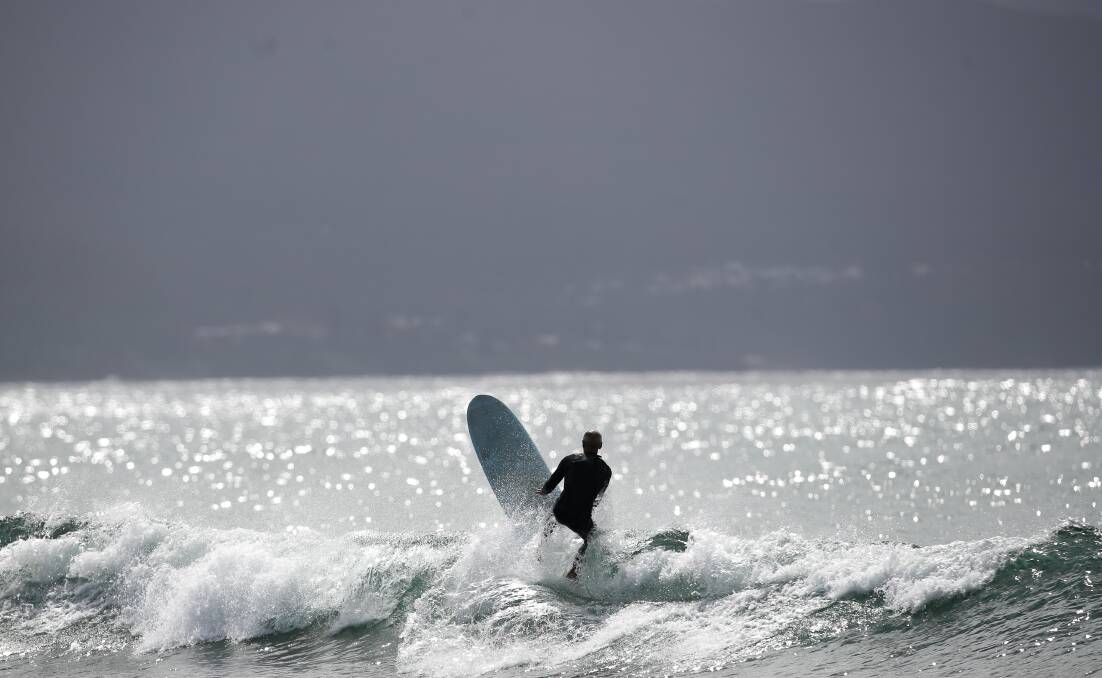 Surfer at Bellambi Point. Picture: Adam McLean.