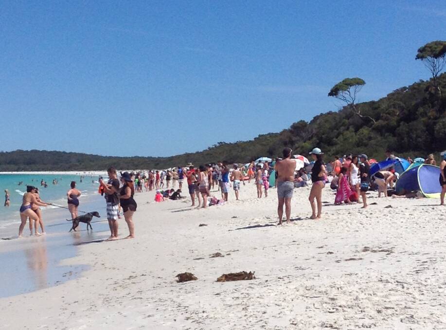Community message: Community leaders have urged visitors to be safe during the school holidays. Picture of Hyams Beach on a busy pre-COVID day. Photo: file. 