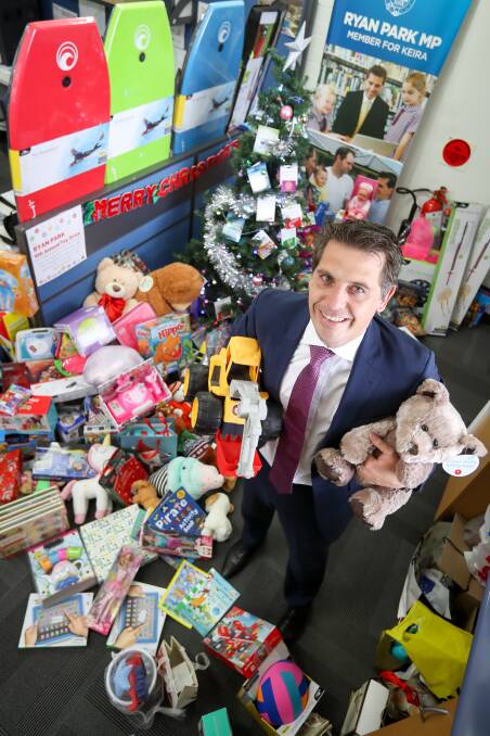 PRESENTS: Keira MP Ryan Park surrounded by toys in his Corrimal office. The gifts went to the Wollongong Homeless Hub and SAHSSI. Picture: Adam McLean