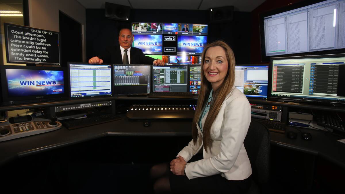 ON AIR: Channel Ten's executive news director John Choueifate and WIN TV's news director Stella Lauri in the studio after the program announcement. Picture: Robert Peet
