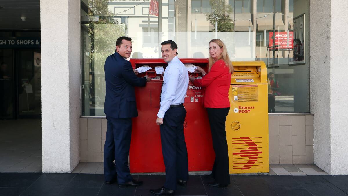 Wollongong MP Paul Scully (left), Member for Keira Ryan Park and Cunningham MP Sharon Bird send their surveys on Monday morning. Picture: Sylvia Liber