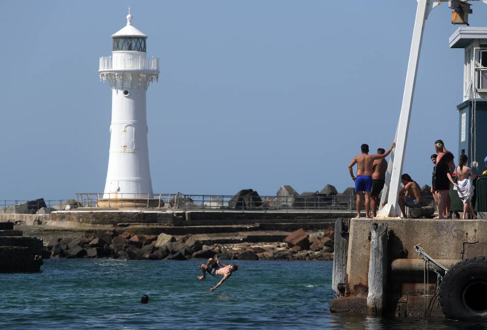 SUMMER DAYS: People cool off at Wollongong Harbour on Monday, as the city prepares for a week of high temperatures. Picture: Robert Peet