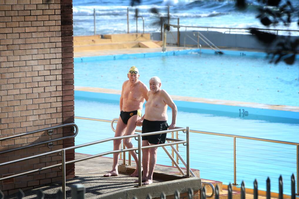 John Pronk and Brennan Keats enjoy the sunshine at Wollongong's continental pool on Friday morning. More sunny skies are forecast over the coming days, with temperatures climbing as high as 26 degrees in parts of the city on Wednesday. Picture: Sylvia Liber