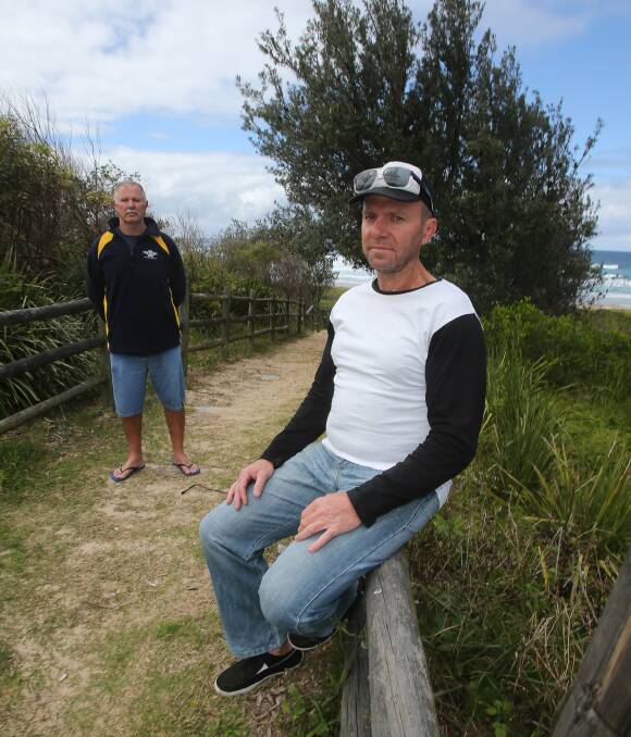 FUTURE FIGHT: Port Kembla Surf Life Saving Club captain David Edwards and  Corrimal Surf Life Saving Club president Tony Cartwright briefed members on Sunday about a decision to deregister their clubs. Picture: Robert Peet