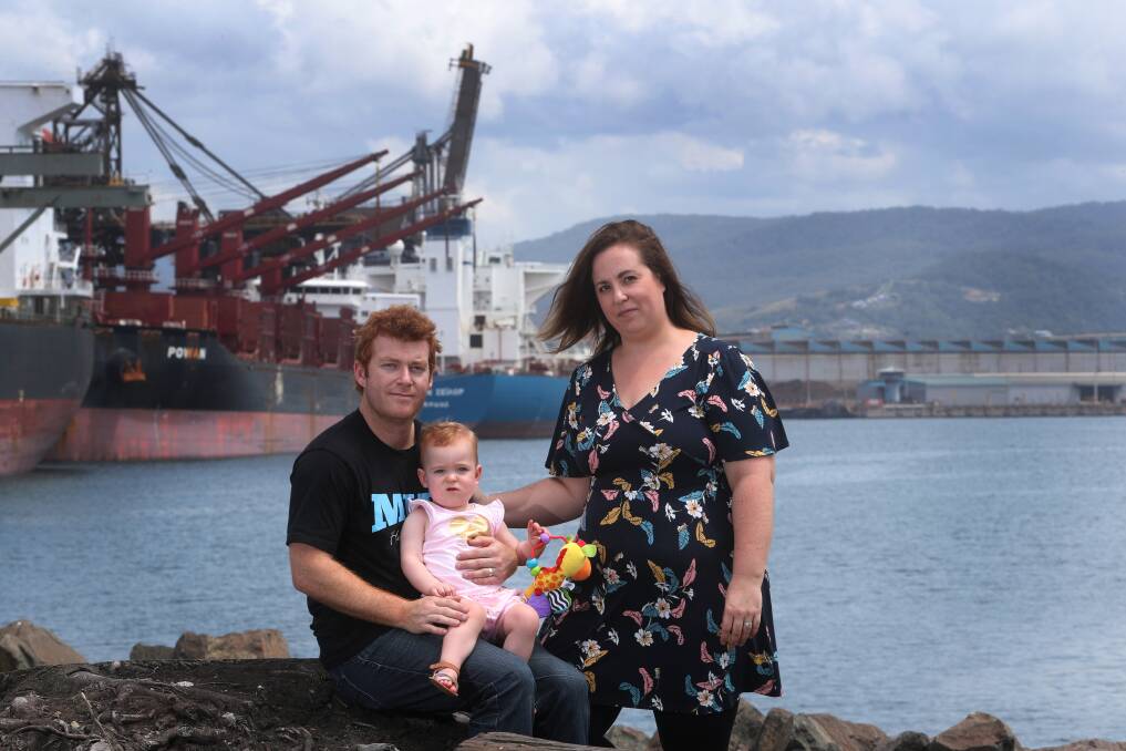 DISAPPOINTED: Seafarer Daniel Bell with his wife, Michala, and 15-month-old daughter, Lily, at Port Kembla. Mr Bell was one of six sacked MV Lowlands Brilliance crew members who arrived in Sydney on Wednesday. Picture: Robert Peet
