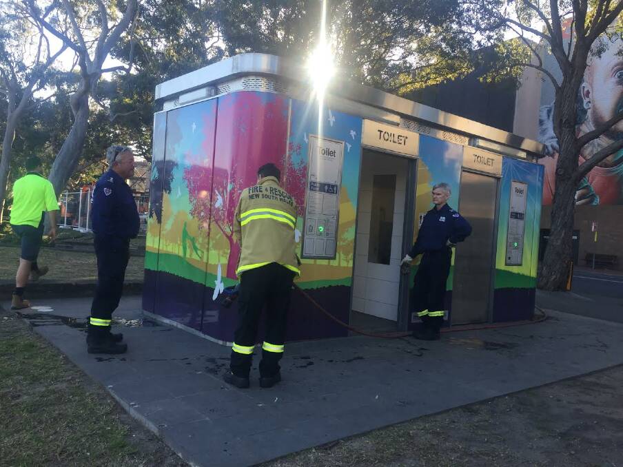 Firefighters at work in the toilet. Picture: Adam McLean