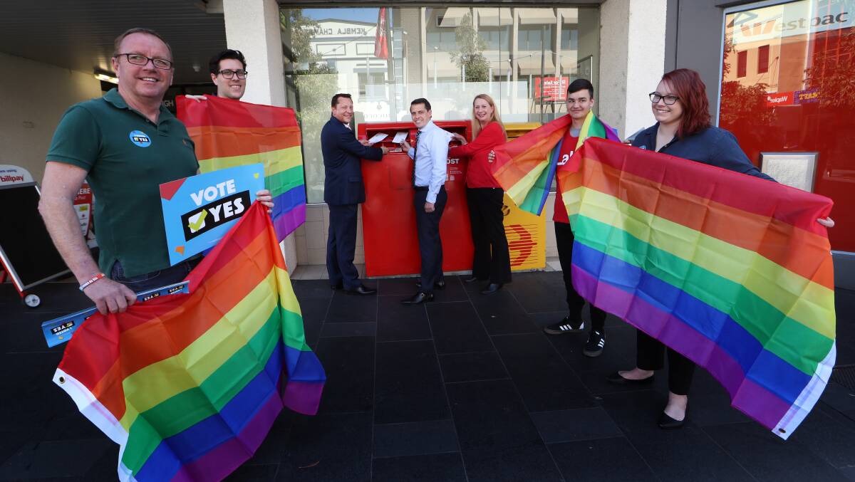 Wollongong MP Paul Scully, Member for Keira Ryan Park and Cunningham MP Sharon Bird send their surveys on Monday, flanked by supporters of the 'yes' campaign. Most Illawarra politicians support a law change to allow same-sex marriage. Picture: Sylvia Liber