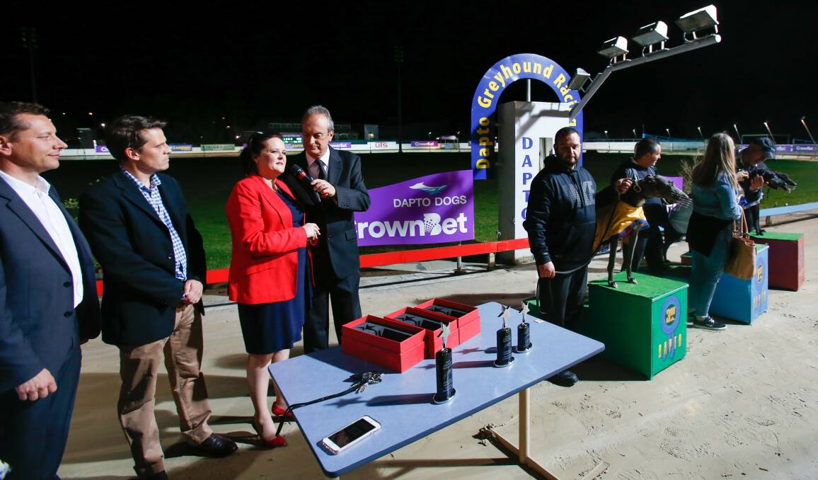 NOT LYING DOWN: Labor candidate Paul Scully (left) joins MPs Ryan Park (Keira) and Anna Watson (Shellharbour) at the Dapto Dogs on Thursday night. Picture: Adam McLean