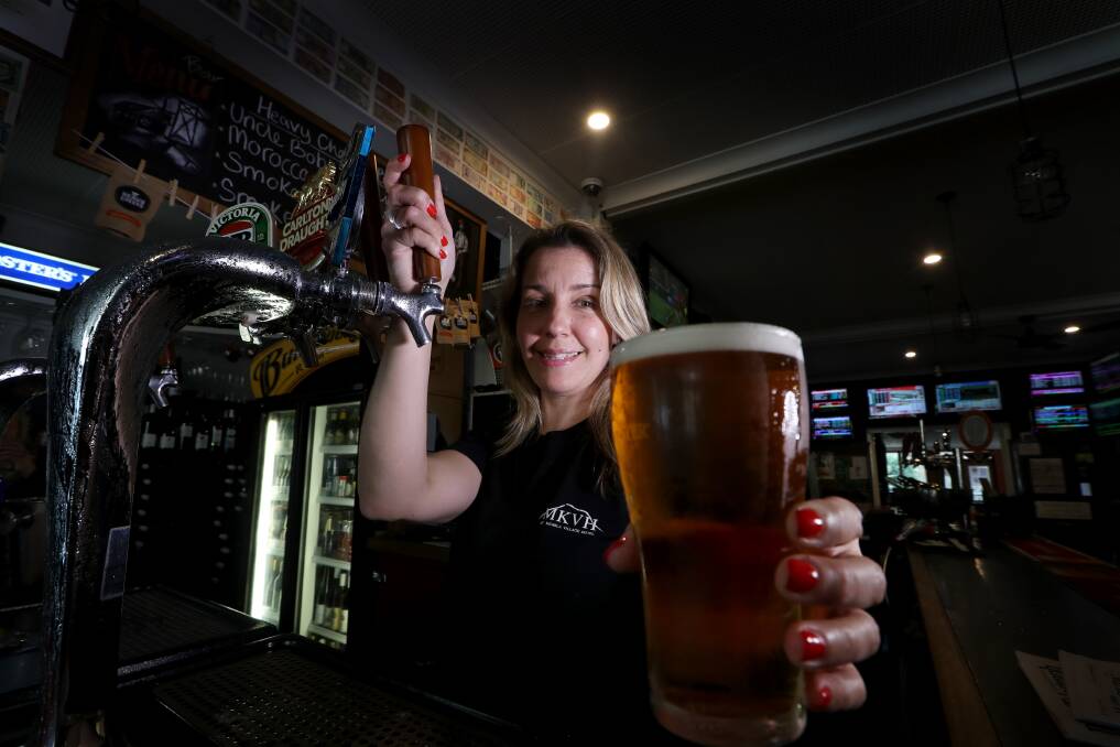 Renee Wachsmuth pulls a beer at the Mount Kembla Village Hotel. A number of Illawarra pubs and clubs are taking part in a "Let it Pour" fundraiser to support drought-ravaged farmers. Picture: Sylvia Liber 