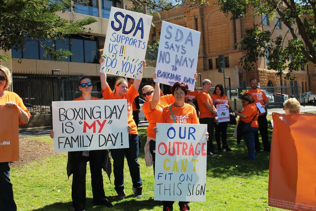 Over 150 workers from across NSW joined Santas outside the NSW Parliament on Tuesday, with SDA members calling on politicians to protect Boxing Day from retail trading. Picture: Supplied