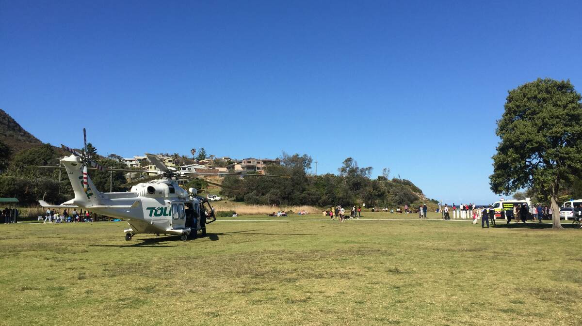 The ambulance rescue helicopter on the scene at Stanwell Park beach. Picture: Adam McLean