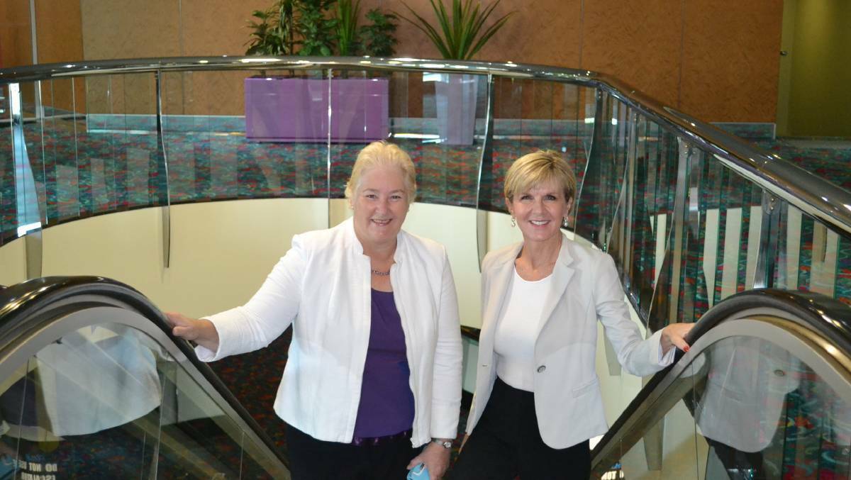 Gilmore MP Ann Sudmalis and Foreign Minister Julie Bishop ride the Batemans Bay Soldiers Club escalator to a breakfast gathering before the federal election in 2016. Ms Bishop gave the gathering a ringing endorsement of Mrs Sudmalis.