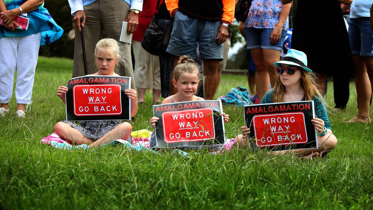 Kiara Fitzgerald (left), Sienna Owers and Emily Owers at Reddall Reserve for Shellharbour's community rally against the proposed council merger in January. Picture: Sylvia Liber