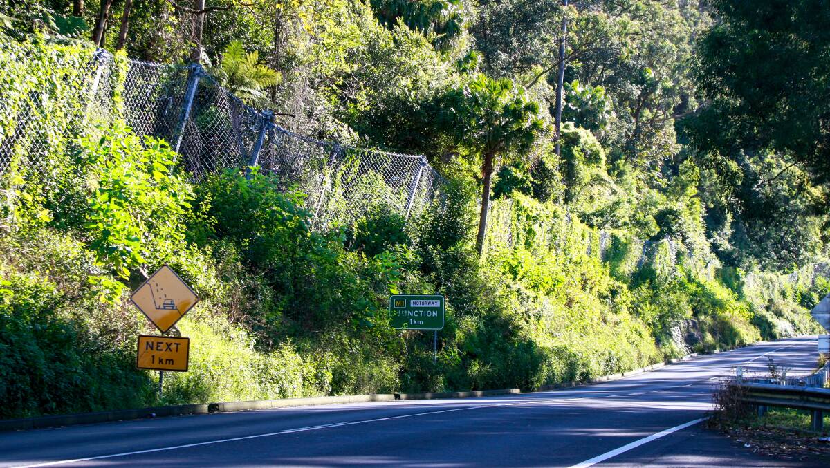 A section of the rock fall protection fencing installed during the first closure of Bulli Pass last year. Picture: Georgia Matts